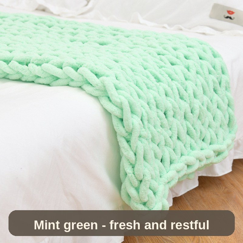 Knitted Weighted Blanket in mint green over white bedding - fresh, light and restful.