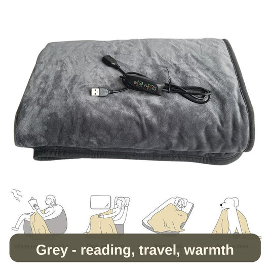 USB Heated Blanket in grey, folded with its controller - for reading, travel, warm sheets or a cosy lap.