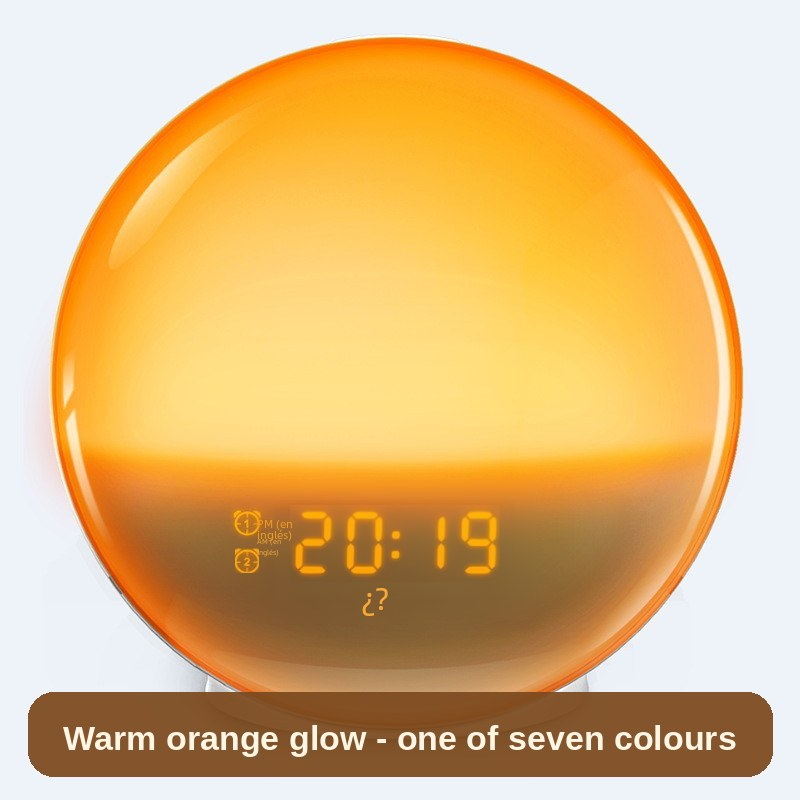 Sunrise Alarm Clock glowing warm orange, front view showing the time - one of seven ambient colours for a gentler start to the day.