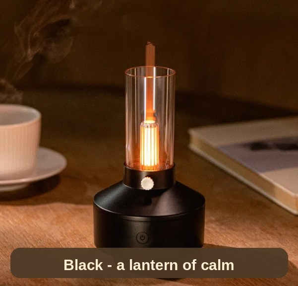 The black Humidifier Lamp lit on a wooden table beside a coffee - a little lantern of calm for slow evenings.