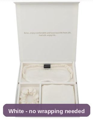 White silk set in the open gift box - a little luxury that needs no wrapping.