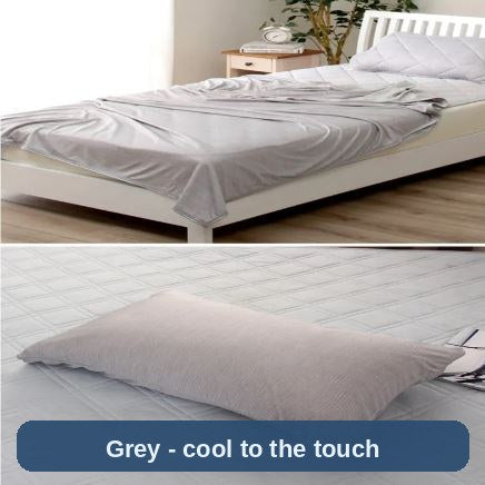 Cooling Blanket in grey on a single bed, with the matching pillow shown - light, smooth and cool to the touch.