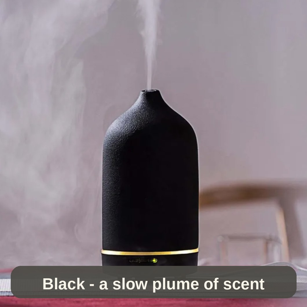 Black Ceramic Diffuser misting gently - a slow plume of your favourite essential oil scent.