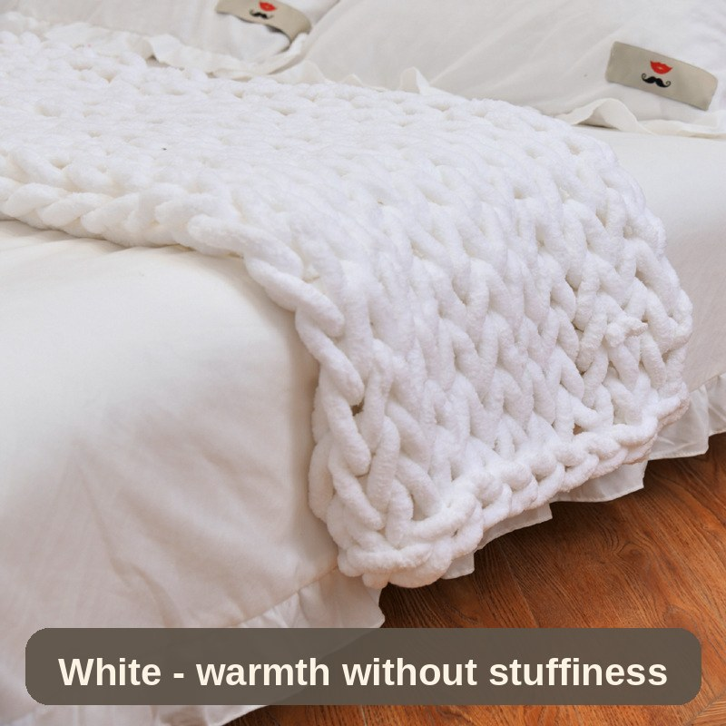 White knitted weighted blanket close up on the bed - the chunky knit gives warmth without stuffiness.