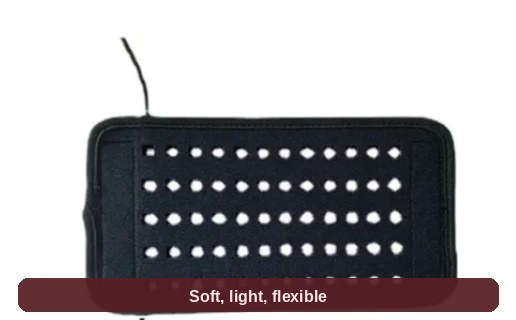 Angled view of the red light belt pad - neat rows of LEDs set into a soft black wrap.