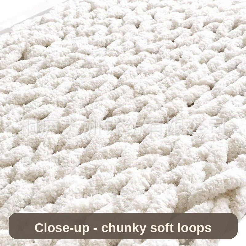 Close-up of the white chunky knit - soft, breathable loops you can sink your fingers into.