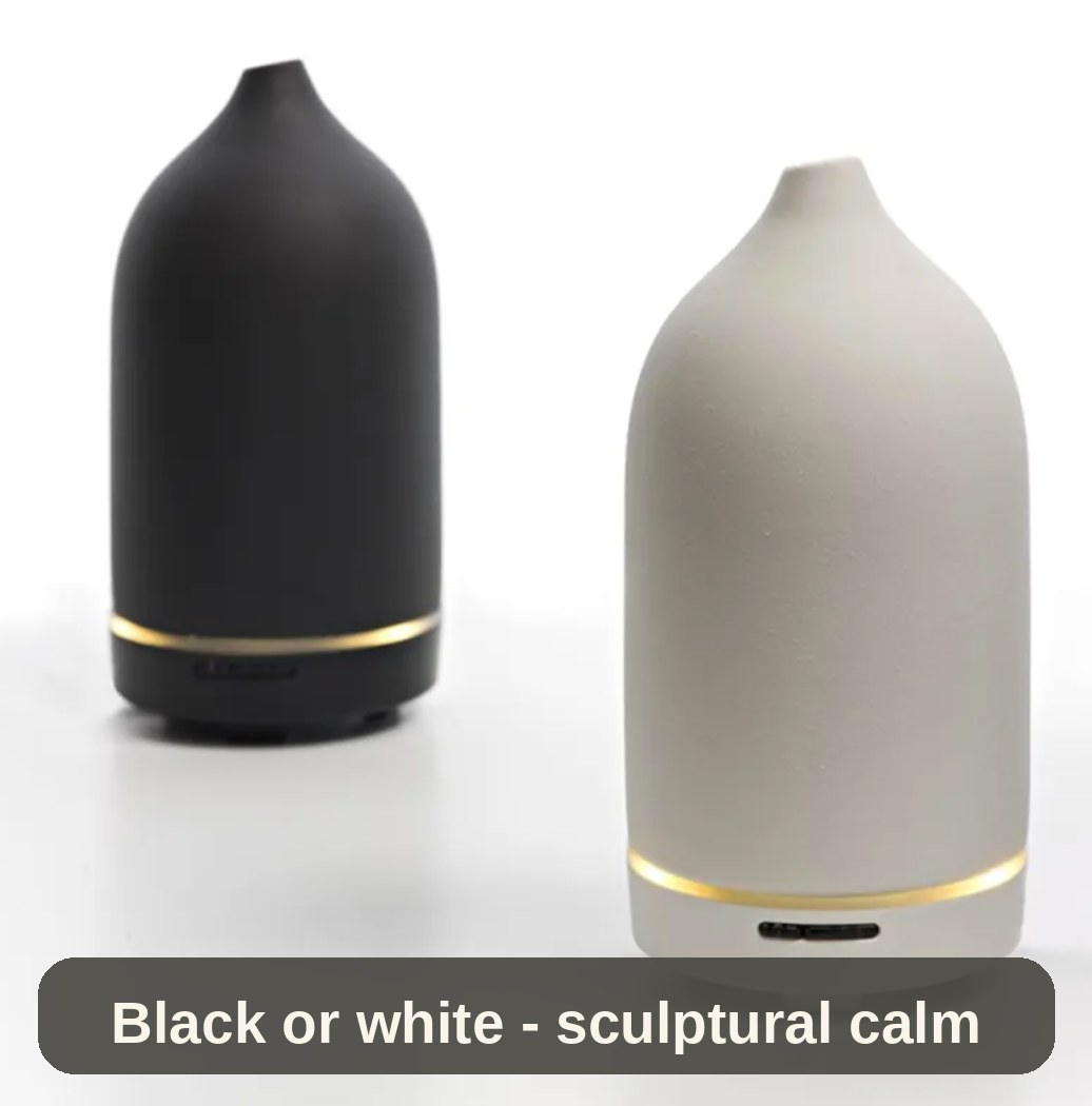 Ceramic Diffuser in black and white side by side - two matte finishes, one calm, sculptural shape.