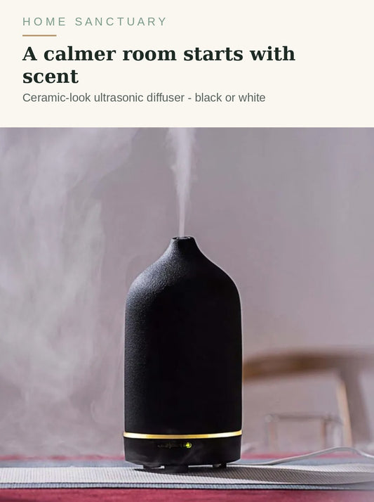 Black ceramic-look ultrasonic diffuser misting in a calm room