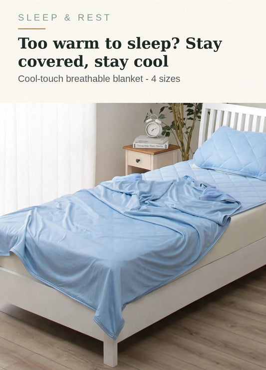 Cooling blanket in blue on a bed - too warm to sleep? Stay covered, stay cool