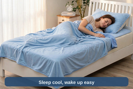 Woman sleeping peacefully under the light blue cooling blanket — sleep cool, wake up easy