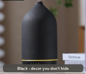Black Ceramic Diffuser on a tabletop, showing its control base - decor you do not have to hide.