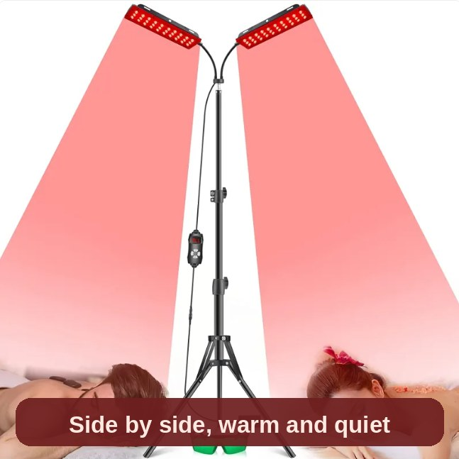 Red light lamp shining over a couple resting side by side - quiet, warm and effortless to set up.