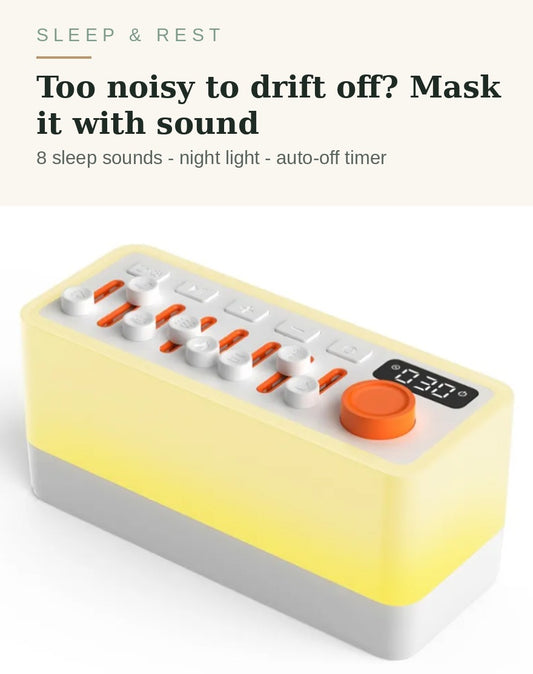White noise sleep sound machine glowing warm on a bedside table